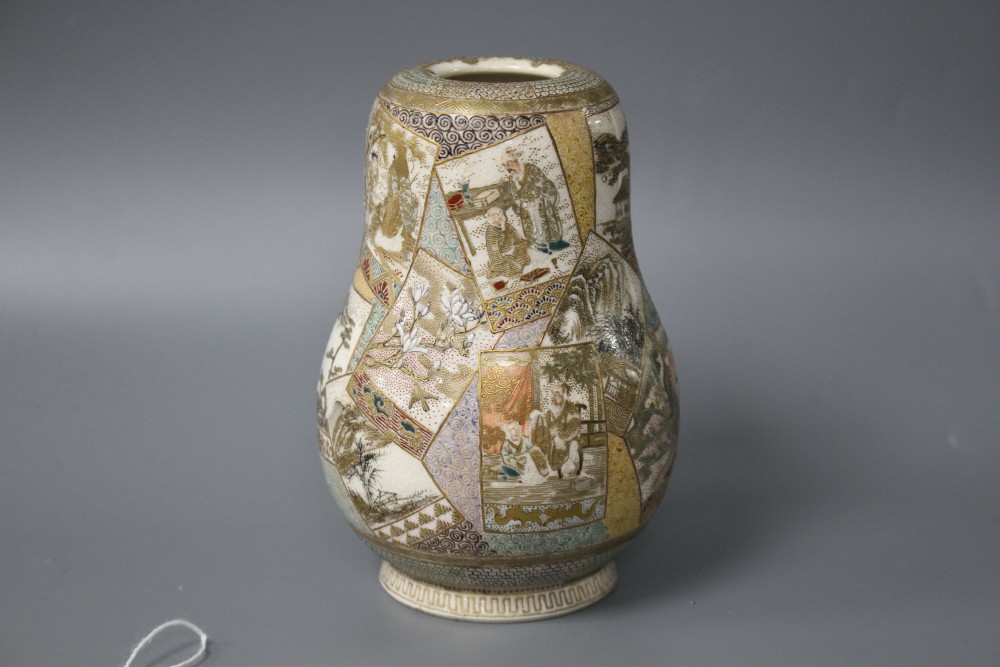 A Satsuma gourd shaped vase, decorated with panels of figures, flowers and landscapes, height 12cm